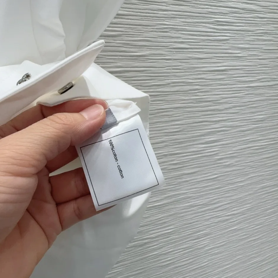 1785899760521333.jpg 洗練された エレガント シャネル シャツ 偽物 コットンノースリーブシャツ ホワイト